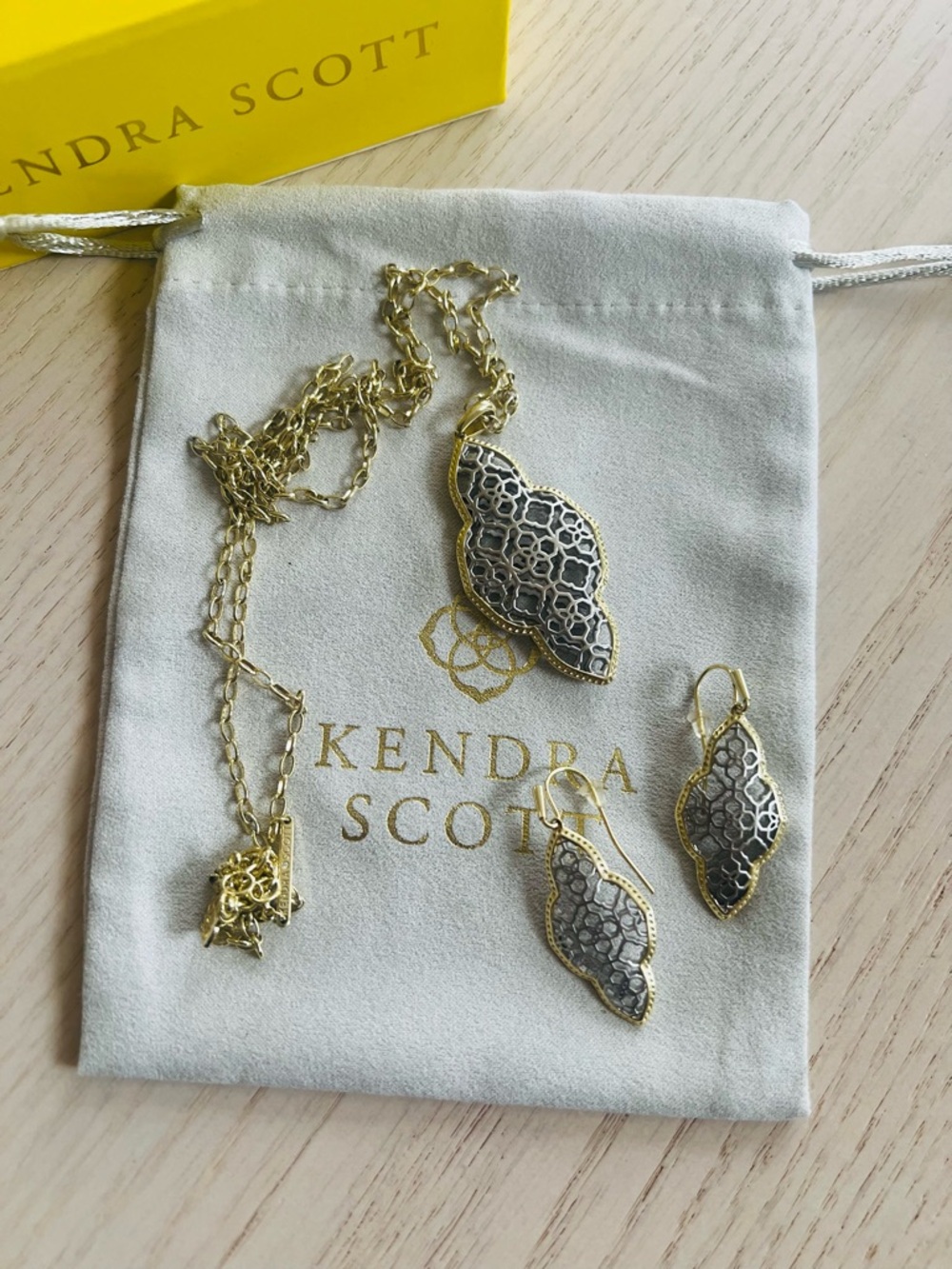 Kendra Scott filigree long necklace and earrings.